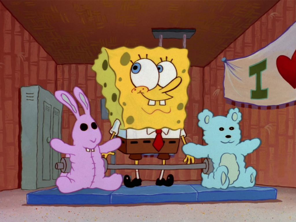 A still from the Spongebob Squarepants animated children's show. in which Spongebob is attempting to deadlift two stuffed animals.